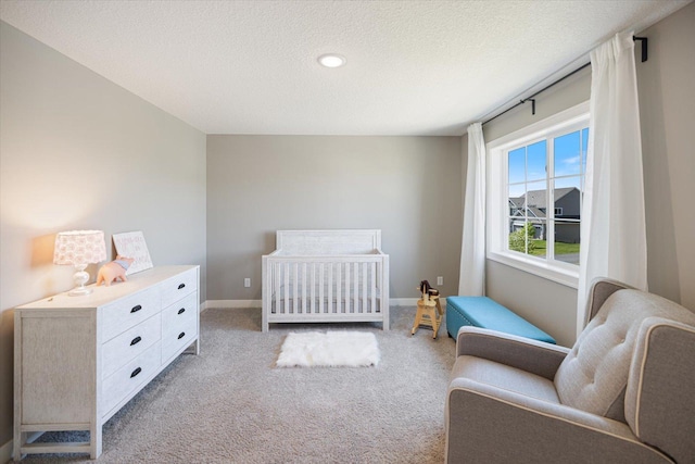 5360 Pine Island Rd, Woodbury, MN 55129 - carpeted bedroom featuring a textured ceiling, baseboards, a crib, and recessed lighting