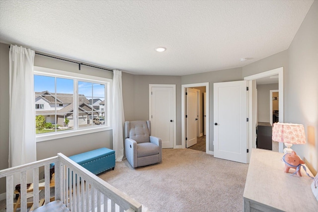 5360 Pine Island Rd, Woodbury, MN 55129 - bedroom featuring carpet flooring, a textured ceiling, recessed lighting, and baseboards
