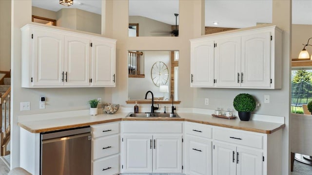 28306 State Highway 25, Belle Plaine, MN 56011 - kitchen with a sink, stainless steel dishwasher, lofted ceiling, white cabinetry, and light countertops