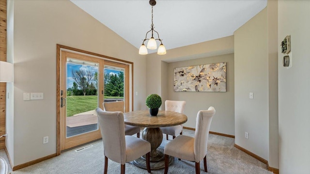 28306 State Highway 25, Belle Plaine, MN 56011 - dining room with baseboards, light carpet, lofted ceiling, and a chandelier