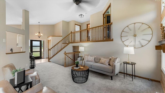 28306 State Highway 25, Belle Plaine, MN 56011 - carpeted living area with ceiling fan, a chandelier, stairway, a high ceiling, and baseboards