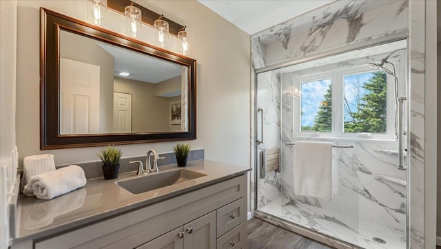 28306 State Highway 25, Belle Plaine, MN 56011 - bathroom featuring vanity, a marble finish shower, and wood finished floors