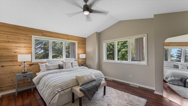 28306 State Highway 25, Belle Plaine, MN 56011 - bedroom featuring wood walls, baseboards, lofted ceiling, wood finished floors, and a ceiling fan