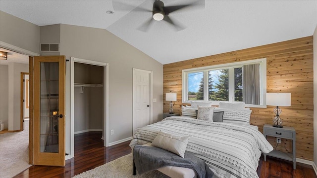 28306 State Highway 25, Belle Plaine, MN 56011 - bedroom featuring wooden walls, lofted ceiling, baseboards, wood finished floors, and ceiling fan