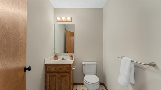 28306 State Highway 25, Belle Plaine, MN 56011 - half bath featuring toilet, vanity, and baseboards