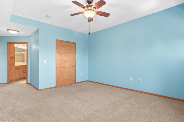 unfurnished bedroom with baseboards, ceiling fan, and light carpet
