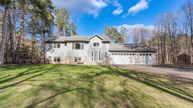 9112 Indigo Rd NW, Watab Twp, MN 56367 - view of front of home featuring an attached garage, a front yard, and aphalt driveway