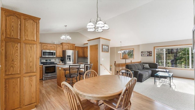 9112 Indigo Rd NW, Watab Twp, MN 56367 - dining room featuring high vaulted ceiling, a chandelier, and light wood finished floors