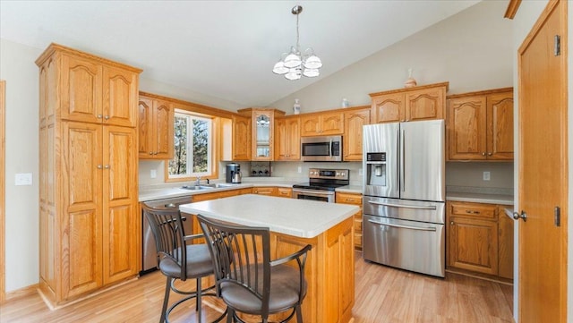 9112 Indigo Rd NW, Watab Twp, MN 56367 - kitchen featuring light countertops, light wood-style flooring, appliances with stainless steel finishes, and a sink