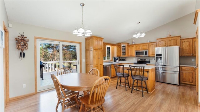 9112 Indigo Rd NW, Watab Twp, MN 56367 - dining room with visible vents, light wood-style flooring, vaulted ceiling, and a chandelier