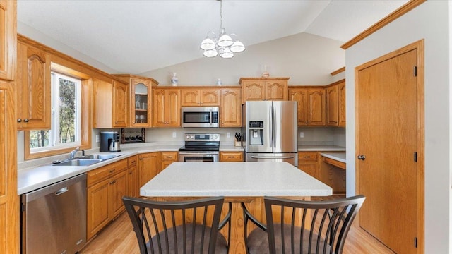 9112 Indigo Rd NW, Watab Twp, MN 56367 - kitchen with vaulted ceiling, a sink, stainless steel appliances, light countertops, and a notable chandelier