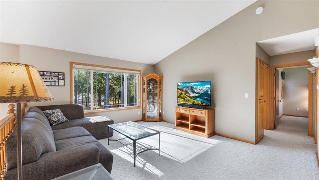 9112 Indigo Rd NW, Watab Twp, MN 56367 - carpeted living room with vaulted ceiling and baseboards