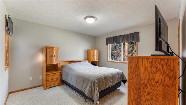 9112 Indigo Rd NW, Watab Twp, MN 56367 - bedroom featuring a textured ceiling, baseboards, and light carpet