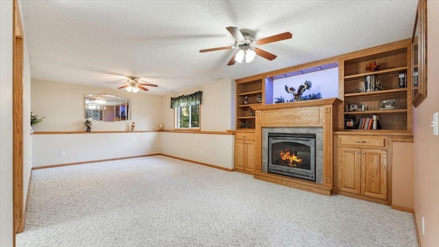 9112 Indigo Rd NW, Watab Twp, MN 56367 - unfurnished living room featuring a glass covered fireplace, baseboards, light colored carpet, and ceiling fan