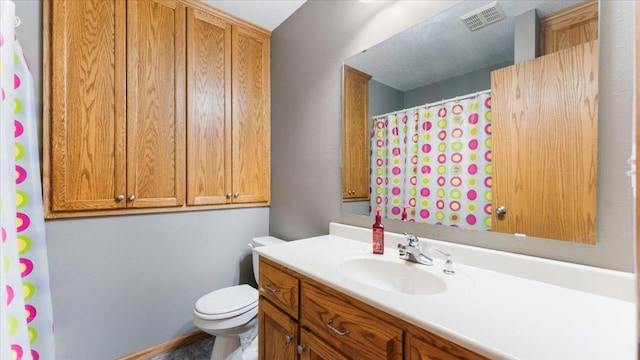 9112 Indigo Rd NW, Watab Twp, MN 56367 - bathroom featuring toilet, vanity, curtained shower, and visible vents