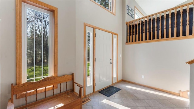 9112 Indigo Rd NW, Watab Twp, MN 56367 - foyer featuring a wealth of natural light, baseboards, and visible vents