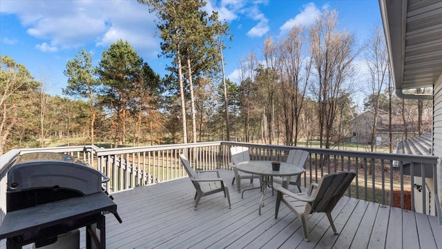 9112 Indigo Rd NW, Watab Twp, MN 56367 - wooden deck with outdoor dining area