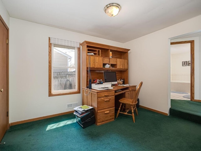 office area with visible vents, baseboards, and carpet floors