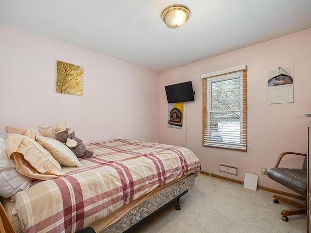 bedroom with carpet and baseboards