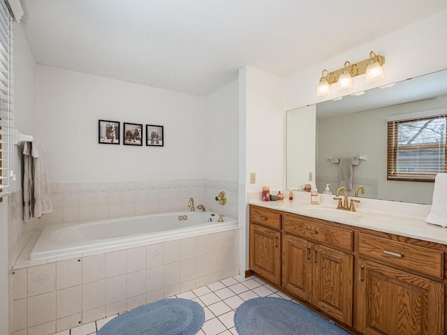 full bath with tile patterned flooring, a garden tub, and vanity