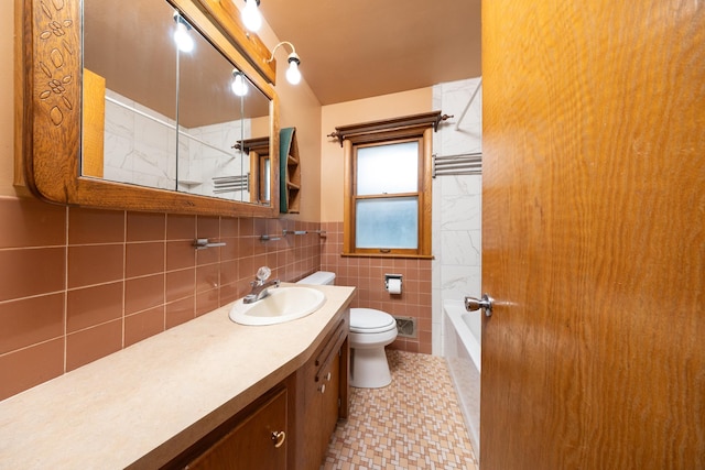 full bath featuring visible vents, toilet, tile walls, vanity, and shower / tub combination