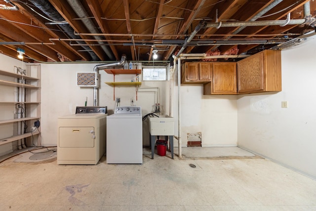 basement featuring washer and clothes dryer