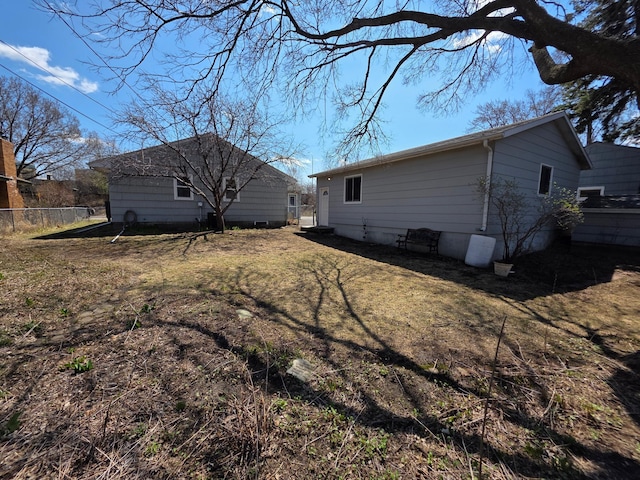 rear view of property with fence