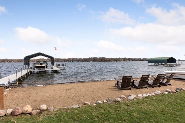 dock area with a water view and boat lift