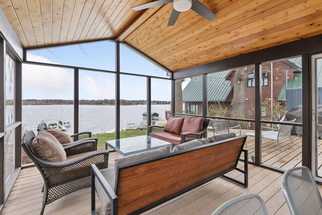 sunroom with an outdoor living space, a water view, and ceiling fan