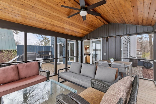 sunroom / solarium featuring outdoor lounge area, a ceiling fan, and plenty of natural light