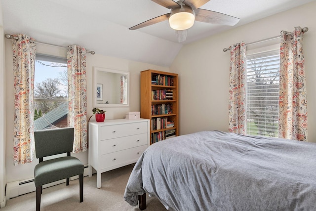 bedroom with lofted ceiling, a ceiling fan, and carpet floors