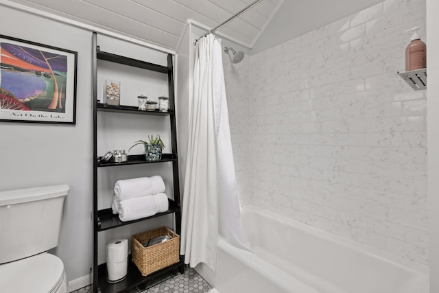 bathroom featuring tile patterned floors, shower / tub combo, toilet, and vaulted ceiling