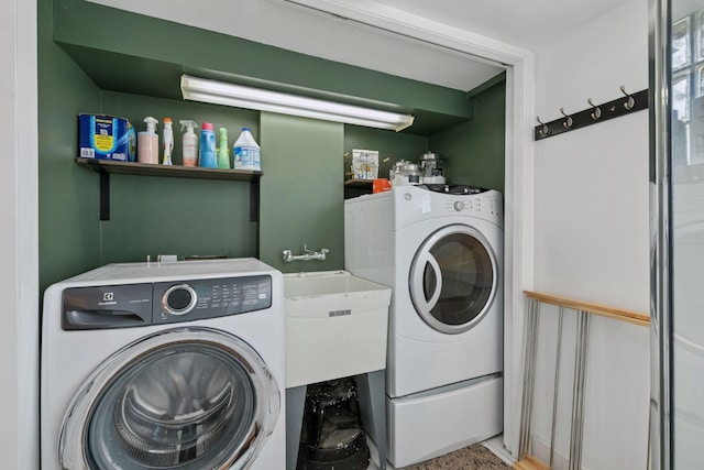laundry room with independent washer and dryer and laundry area