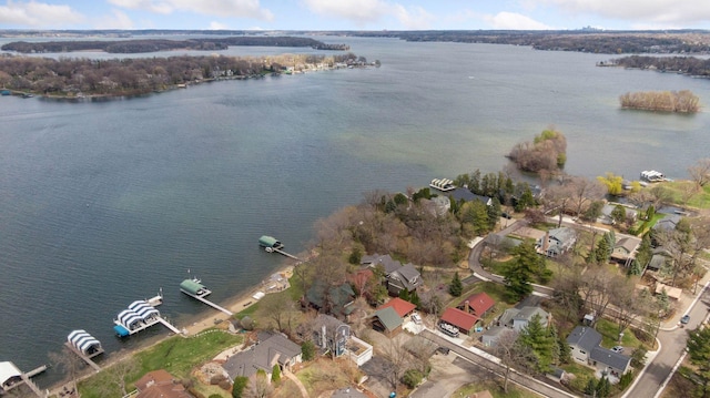 bird's eye view featuring a residential view and a water view