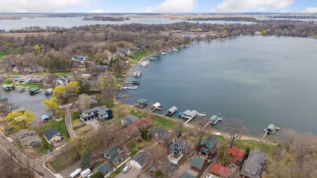 birds eye view of property with a water view and a residential view