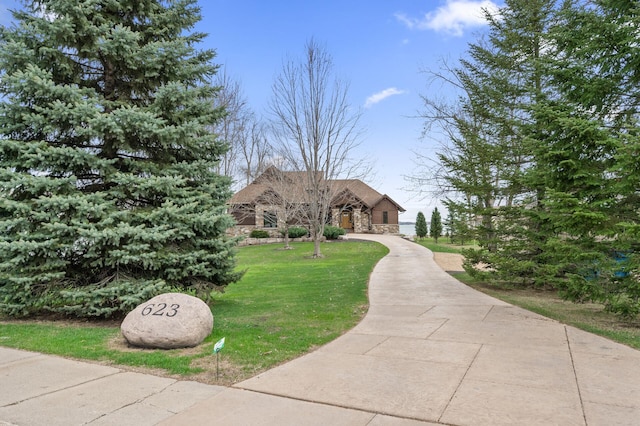 623 Shore Dr, Forest Lake, MN 55025 - view of front facade with a front lawn and stone siding