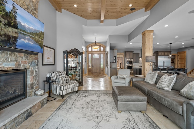 623 Shore Dr, Forest Lake, MN 55025 - living room with wood ceiling, decorative columns, recessed lighting, and stone tile flooring