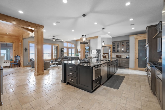 623 Shore Dr, Forest Lake, MN 55025 - kitchen featuring stainless steel appliances, recessed lighting, a center island with sink, and a sink