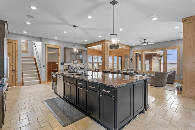 623 Shore Dr, Forest Lake, MN 55025 - kitchen with recessed lighting, a sink, plenty of natural light, and stone tile floors