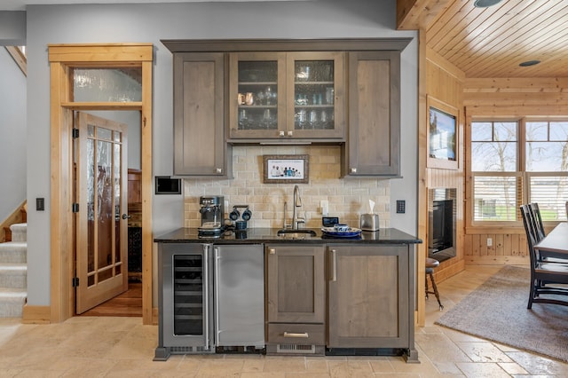 623 Shore Dr, Forest Lake, MN 55025 - bar featuring beverage cooler, wooden ceiling, tasteful backsplash, a sink, and wet bar