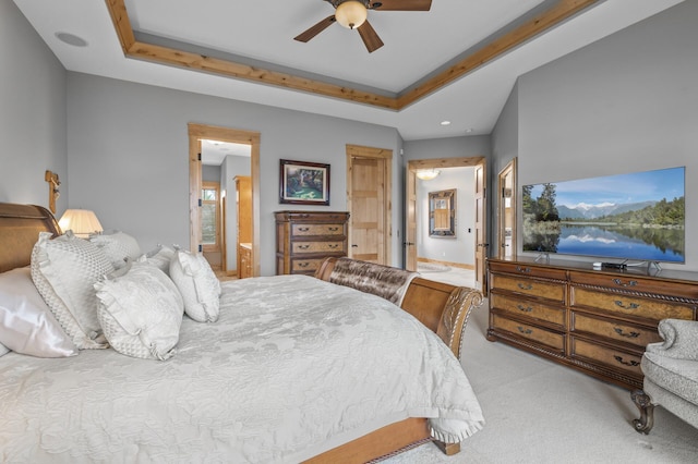 623 Shore Dr, Forest Lake, MN 55025 - carpeted bedroom featuring recessed lighting, ceiling fan, ensuite bath, and a tray ceiling