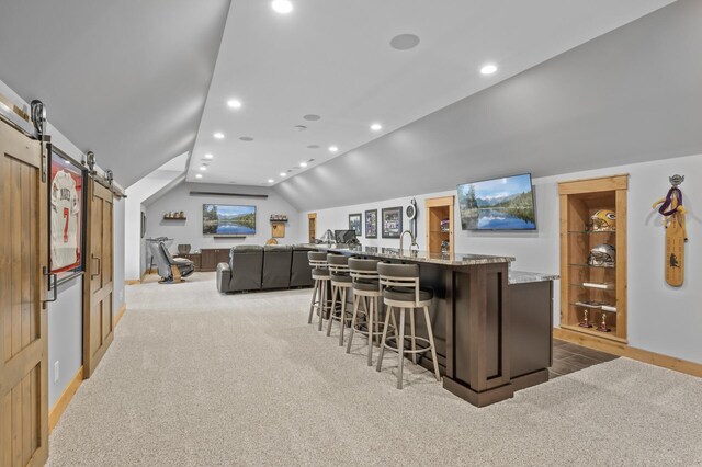 623 Shore Dr, Forest Lake, MN 55025 - bar featuring lofted ceiling, light carpet, indoor wet bar, recessed lighting, and a barn door