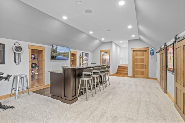 623 Shore Dr, Forest Lake, MN 55025 - bar featuring a barn door, recessed lighting, baseboards, vaulted ceiling, and bar area