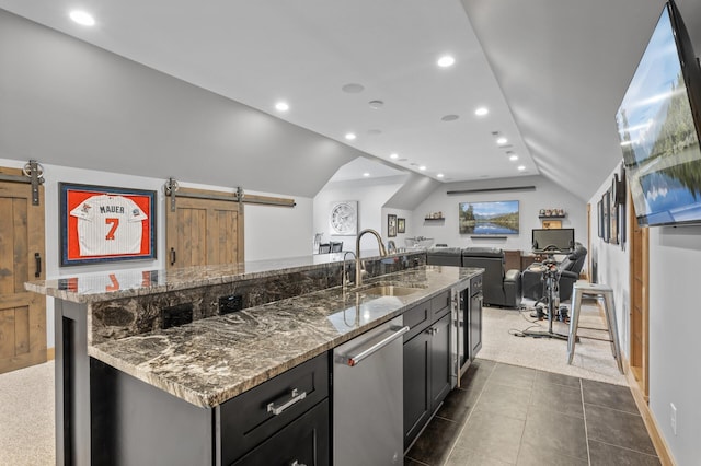 623 Shore Dr, Forest Lake, MN 55025 - kitchen with lofted ceiling, stone countertops, a barn door, a sink, and dishwasher