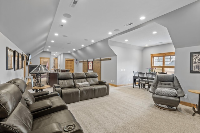 623 Shore Dr, Forest Lake, MN 55025 - carpeted living room featuring visible vents, baseboards, recessed lighting, a barn door, and vaulted ceiling