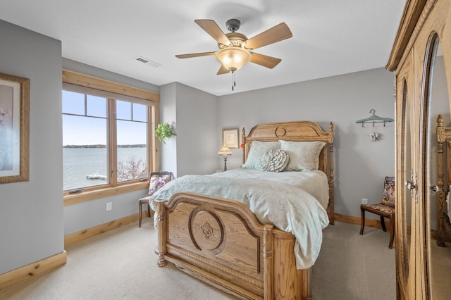 623 Shore Dr, Forest Lake, MN 55025 - bedroom featuring a water view, baseboards, visible vents, and light carpet