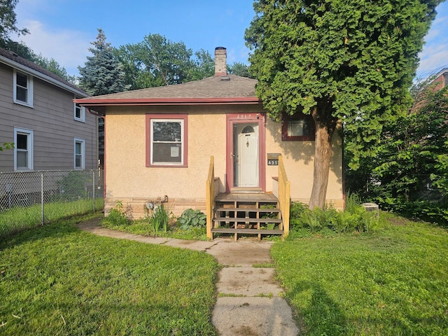 4517 4th Ave S, Minneapolis, MN 55419 - bungalow-style home featuring a chimney, stucco siding, and roof with shingles