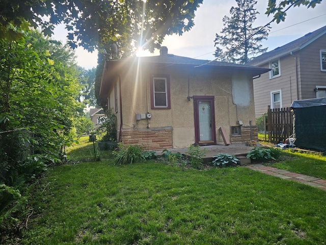 4517 4th Ave S, Minneapolis, MN 55419 - back of property featuring stucco siding and a chimney