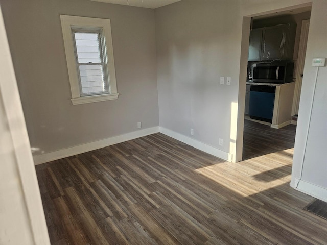 4517 4th Ave S, Minneapolis, MN 55419 - unfurnished room with dark wood-style flooring and baseboards