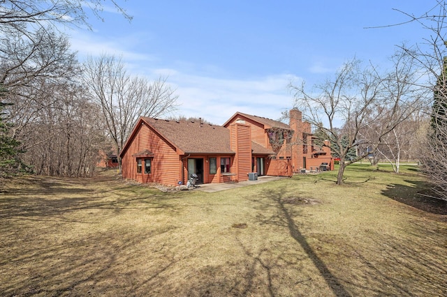 10695 53rd Ave N, Plymouth, MN 55442 - rear view of house featuring a chimney, a lawn, and a patio area